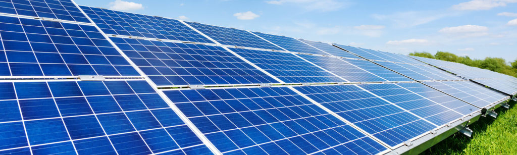 Row of solar panels in a field